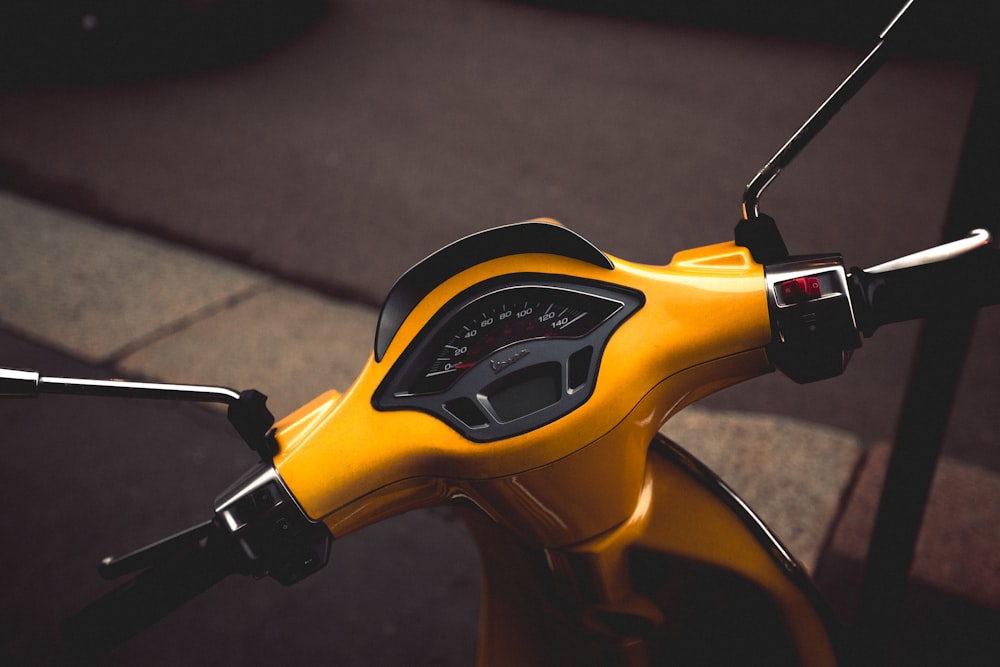 photo of yellow motor scooter