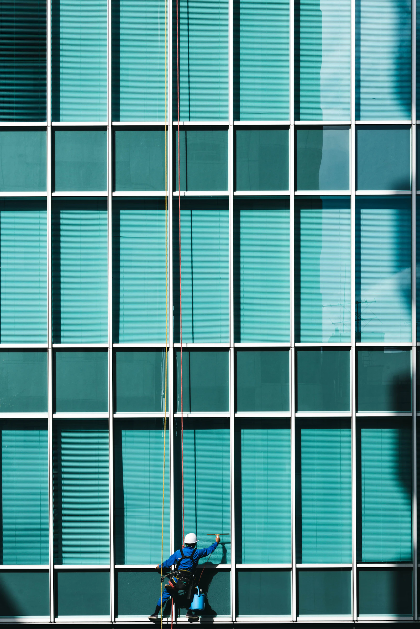 Cleaner polishing glass to a streak-free finish during a handover touch-up