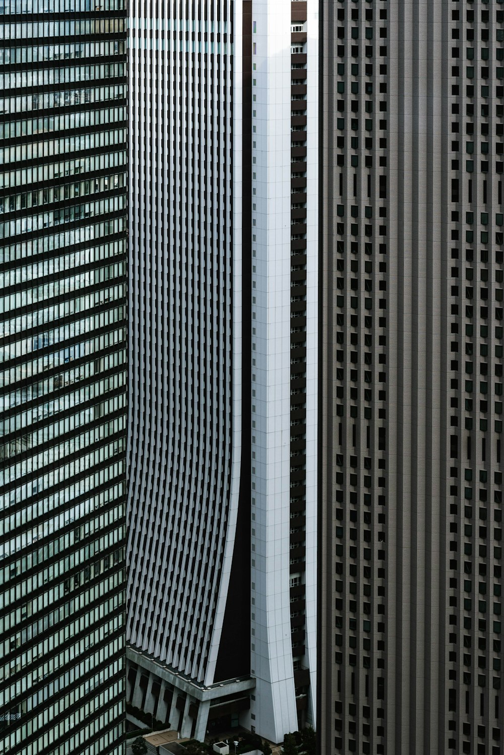 gray, white, and brown high-rise buildings