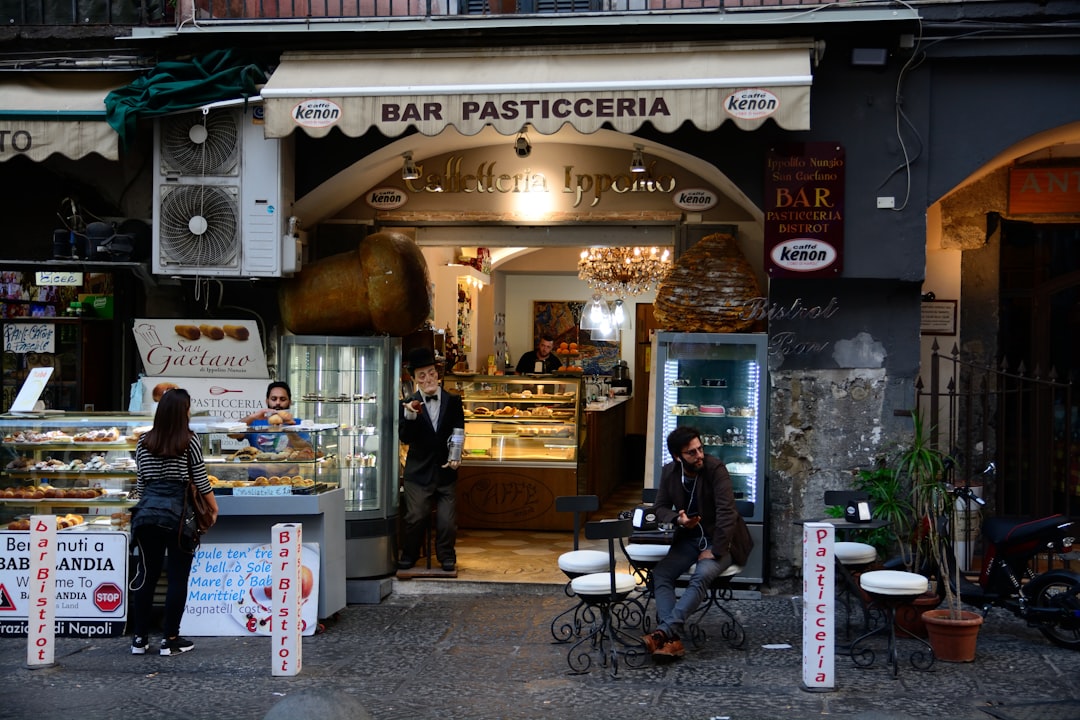 bar Pasticceria with people dining, Italian street