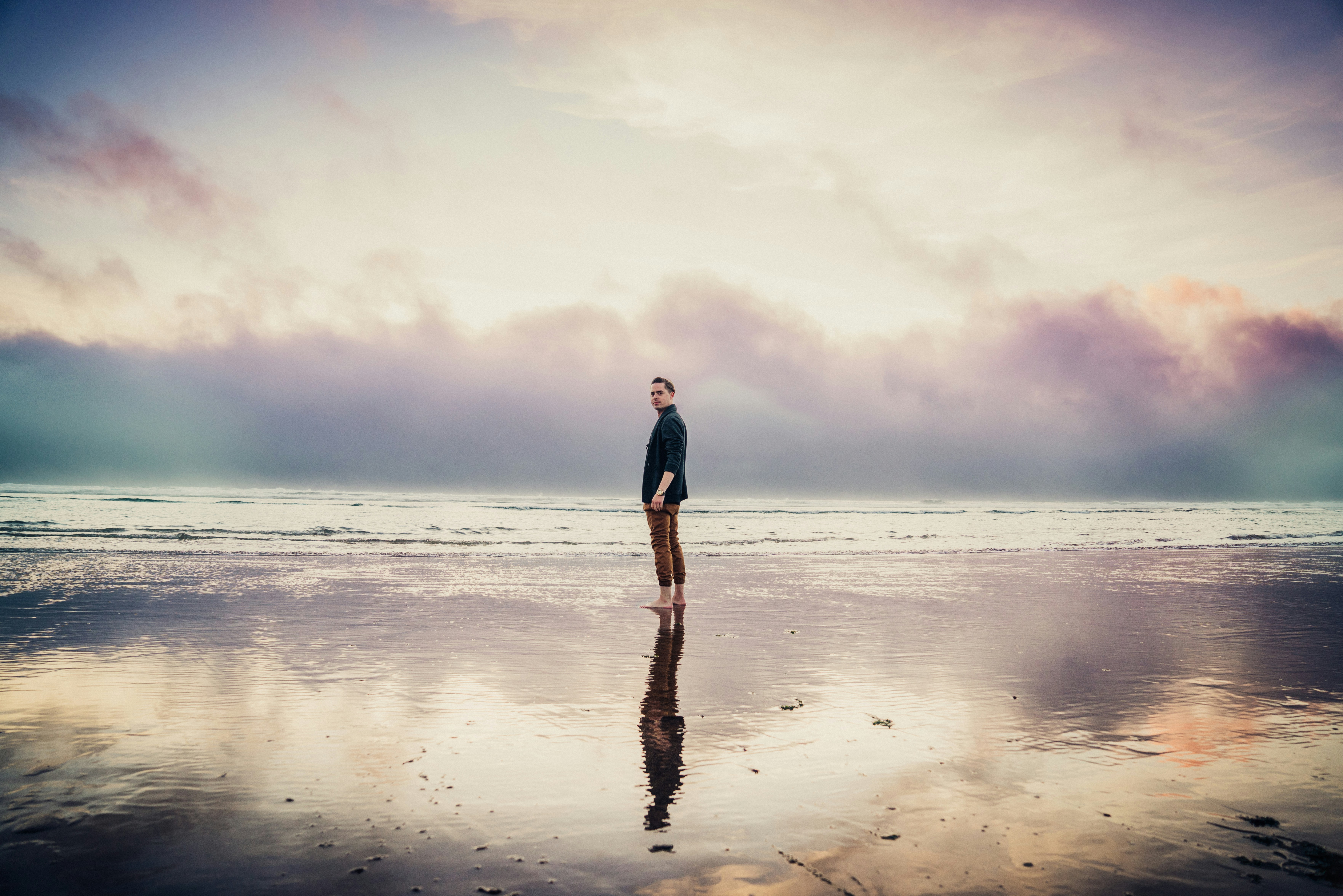 man standing on the seashore, Cannon Beach Sunset