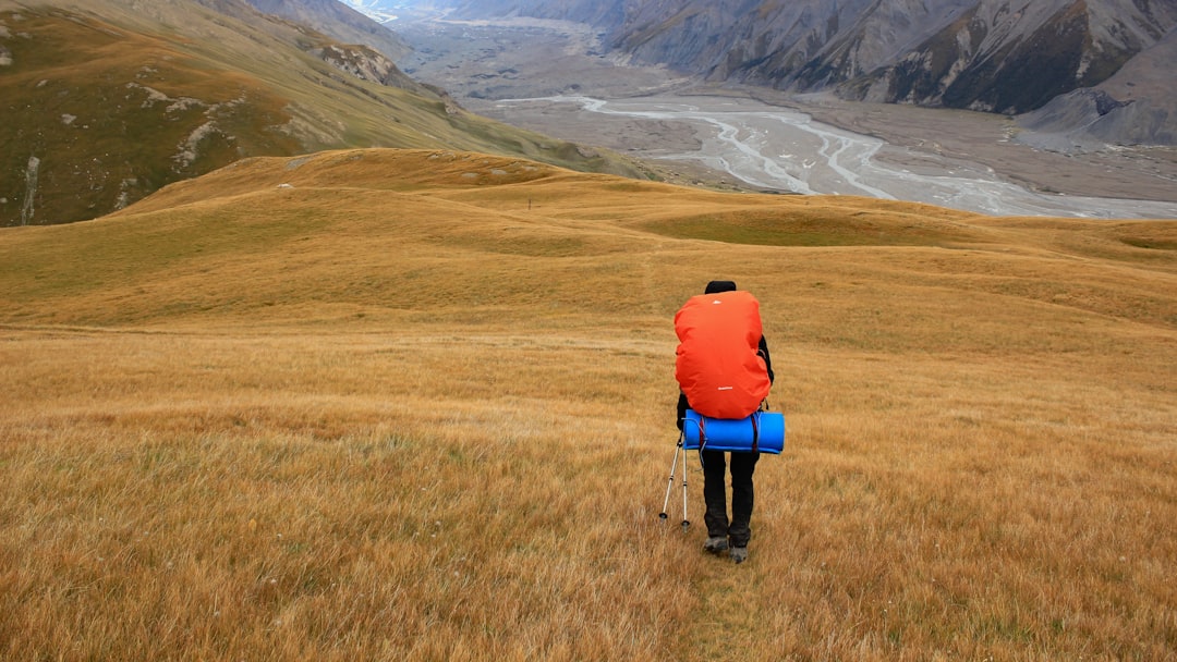 person walking on mountain,