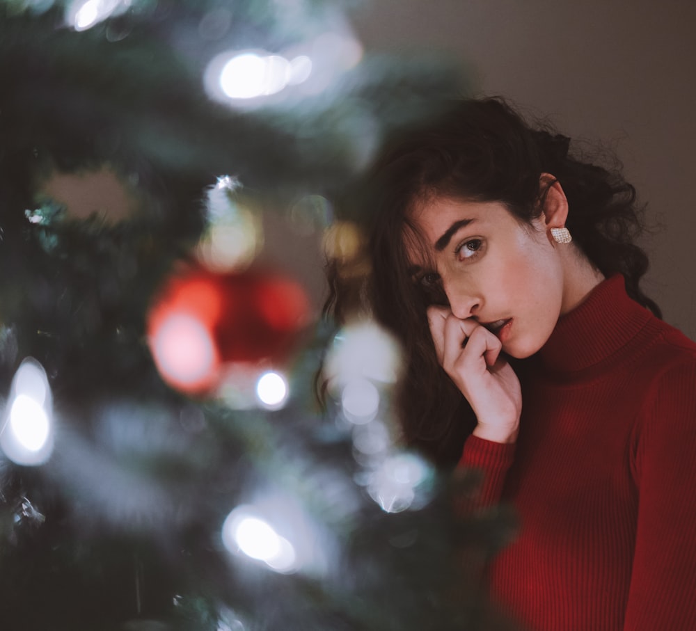 woman standing near green Christmas tree