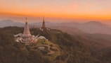 bird's-eye view of white temple surround by trees