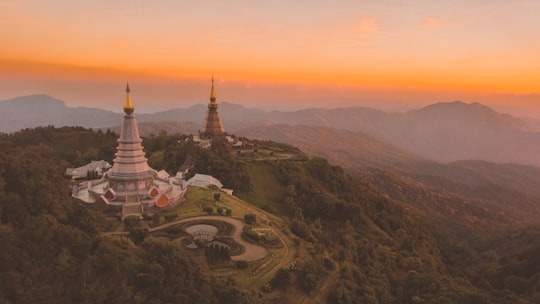 bird's-eye view of white temple surround by trees in Doi Inthanon Thailand