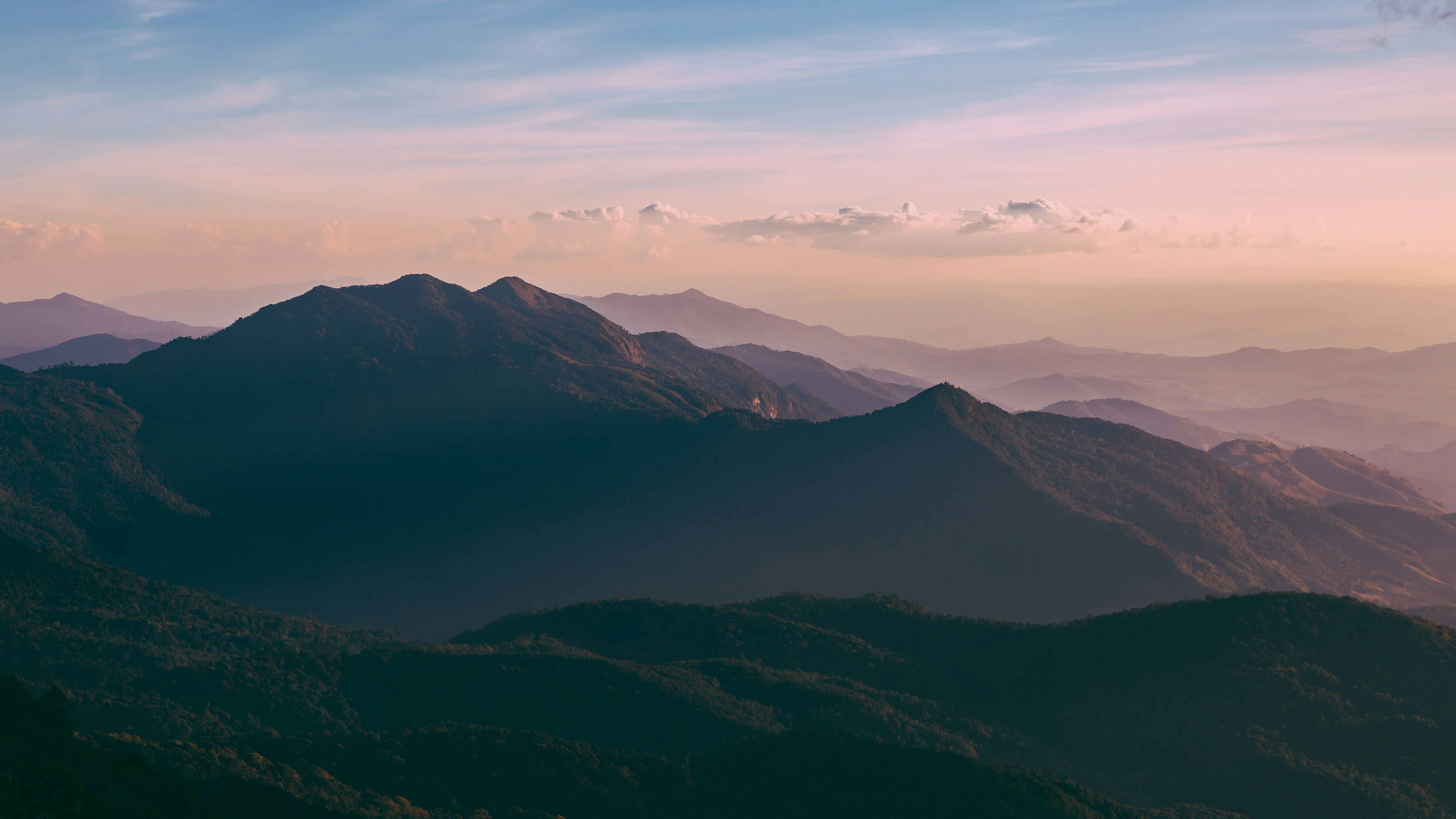 green and brown mountain landscape photo, A 3-hour motorcycle ride from Chiang Mai, we make it to the highest point in Thailand. Doi Inthanon. Taken in total silence with no one around with my two best travel buddies. I will remember this November 2017 for a long time.