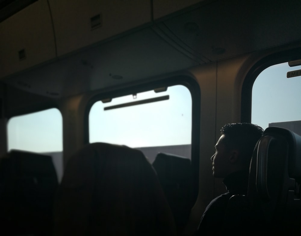 person sitting on train chair