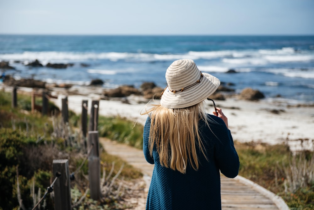 woman walking on seashore