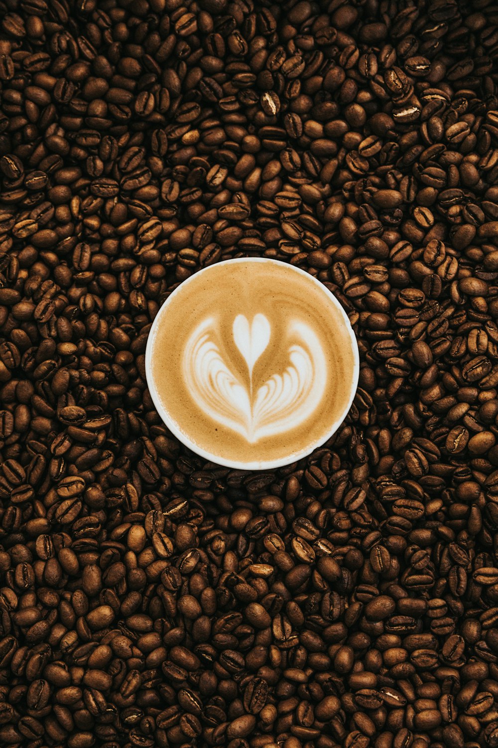 top view photography of heart latte coffee