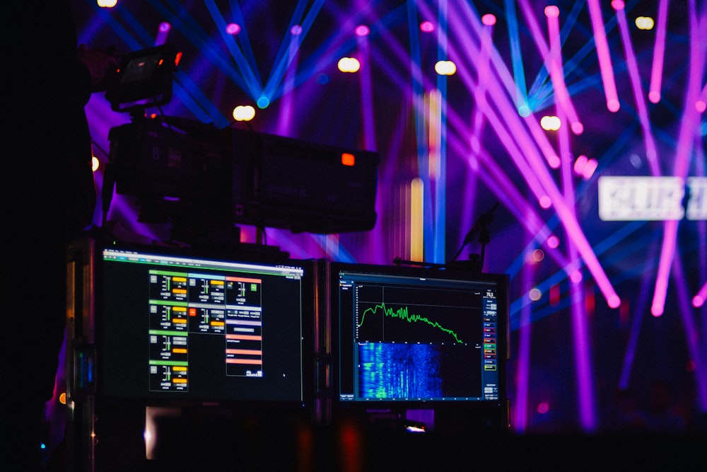 two flat screen monitors in disco room