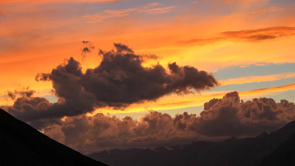 black clouds during golden hour