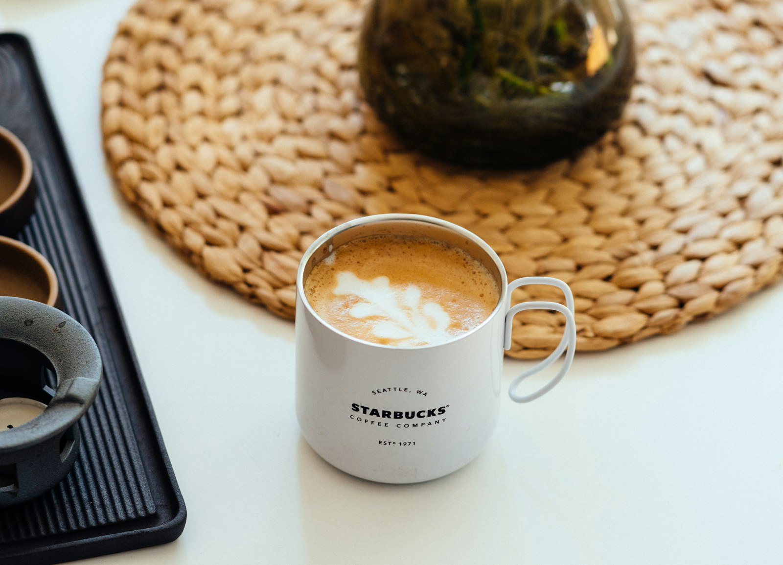 Sony a6300 + Sony FE 85mm F1.8 sample photo. Cappuccino in white starbucks photography