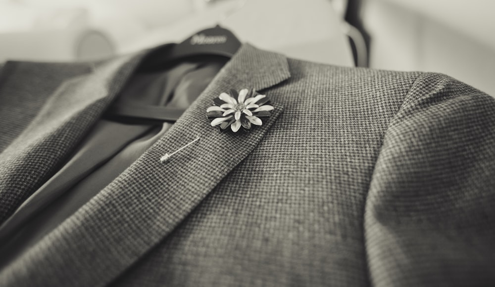 closeup photo of gray notched lapel suit jacket