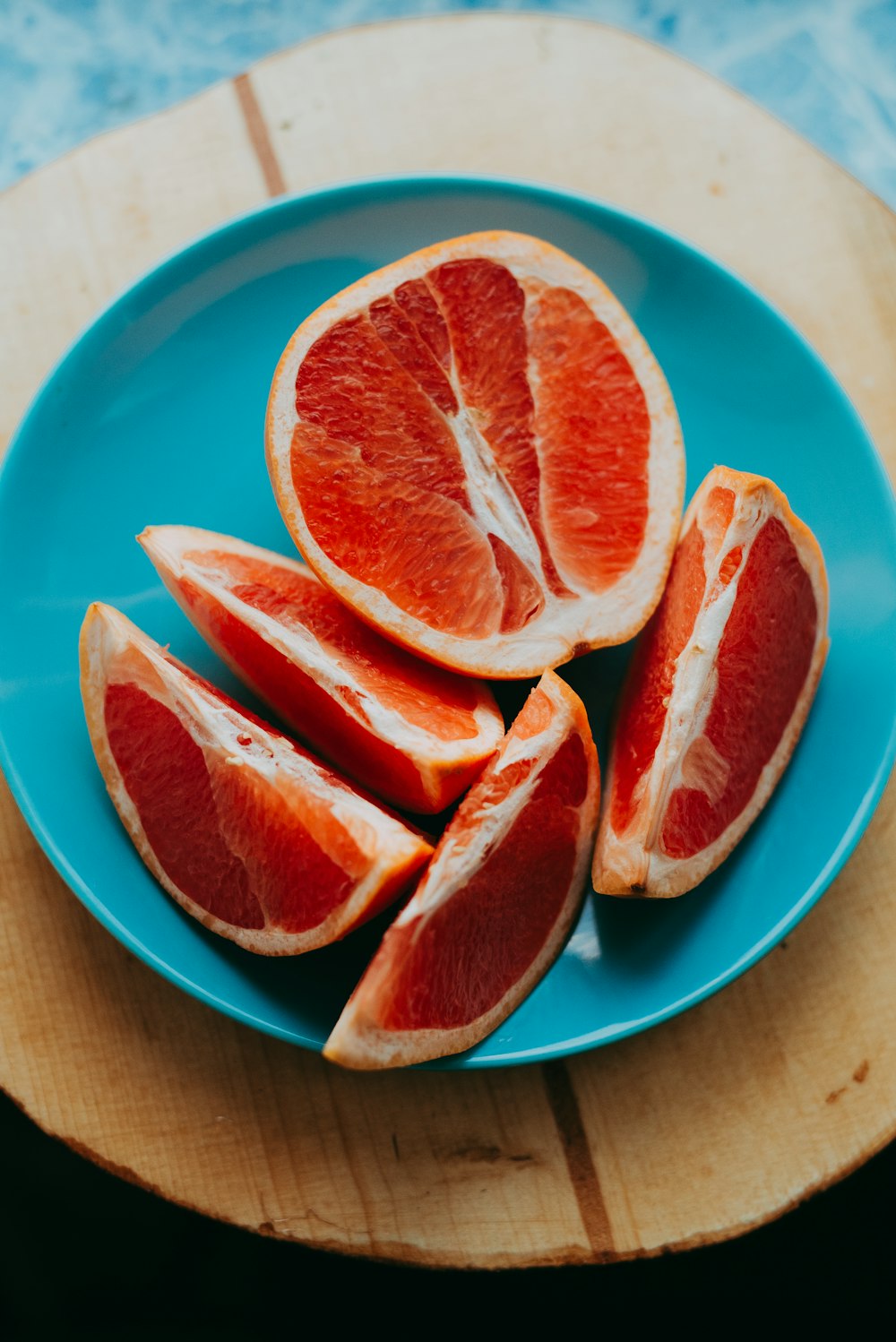 slice fruits on blue plate