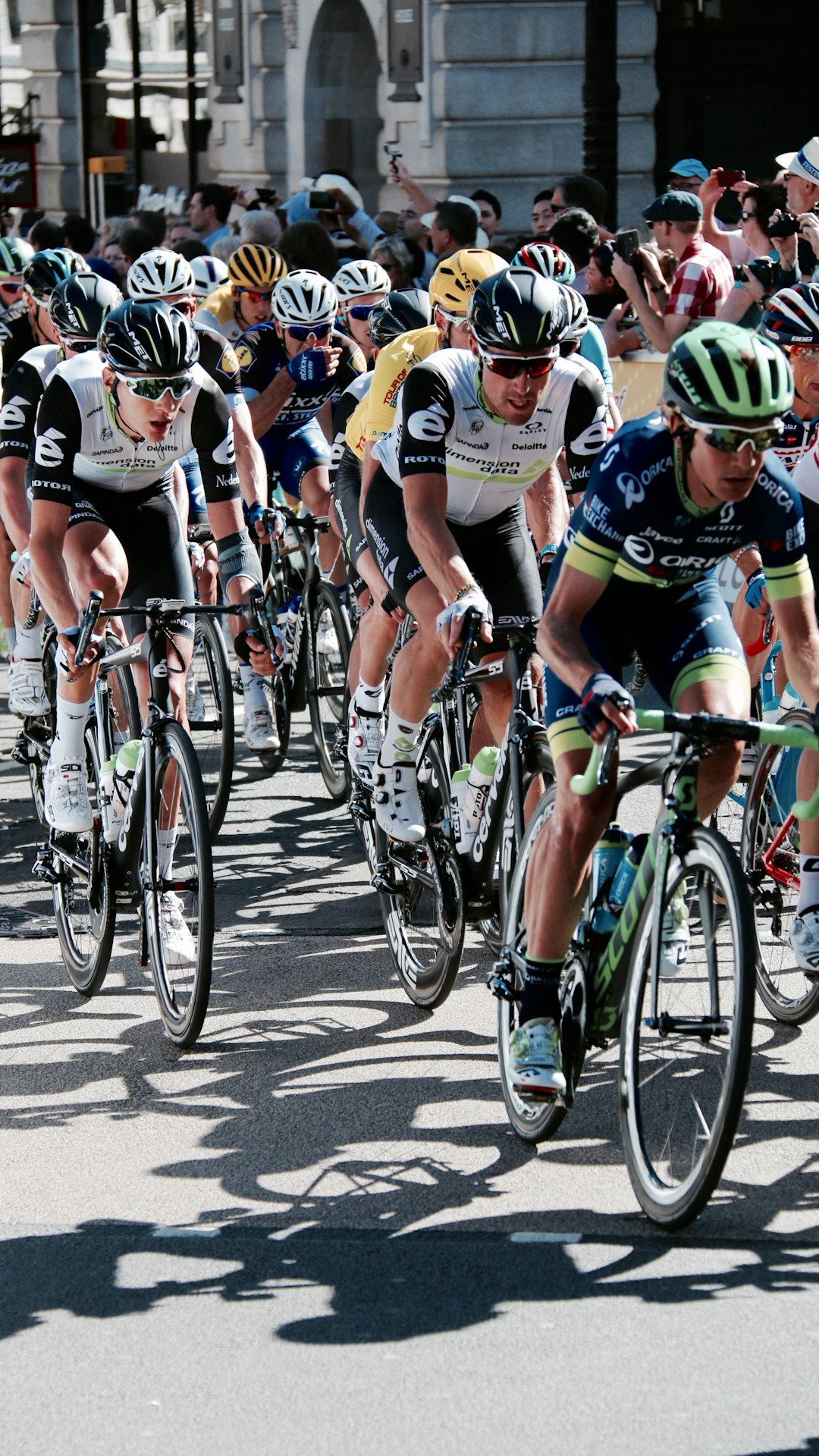 group of people riding road bike is about to begin the race