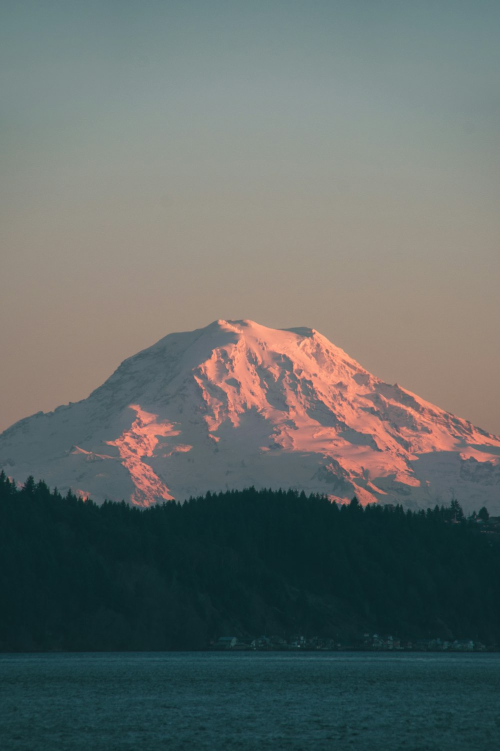 snow filled mountain near green trees