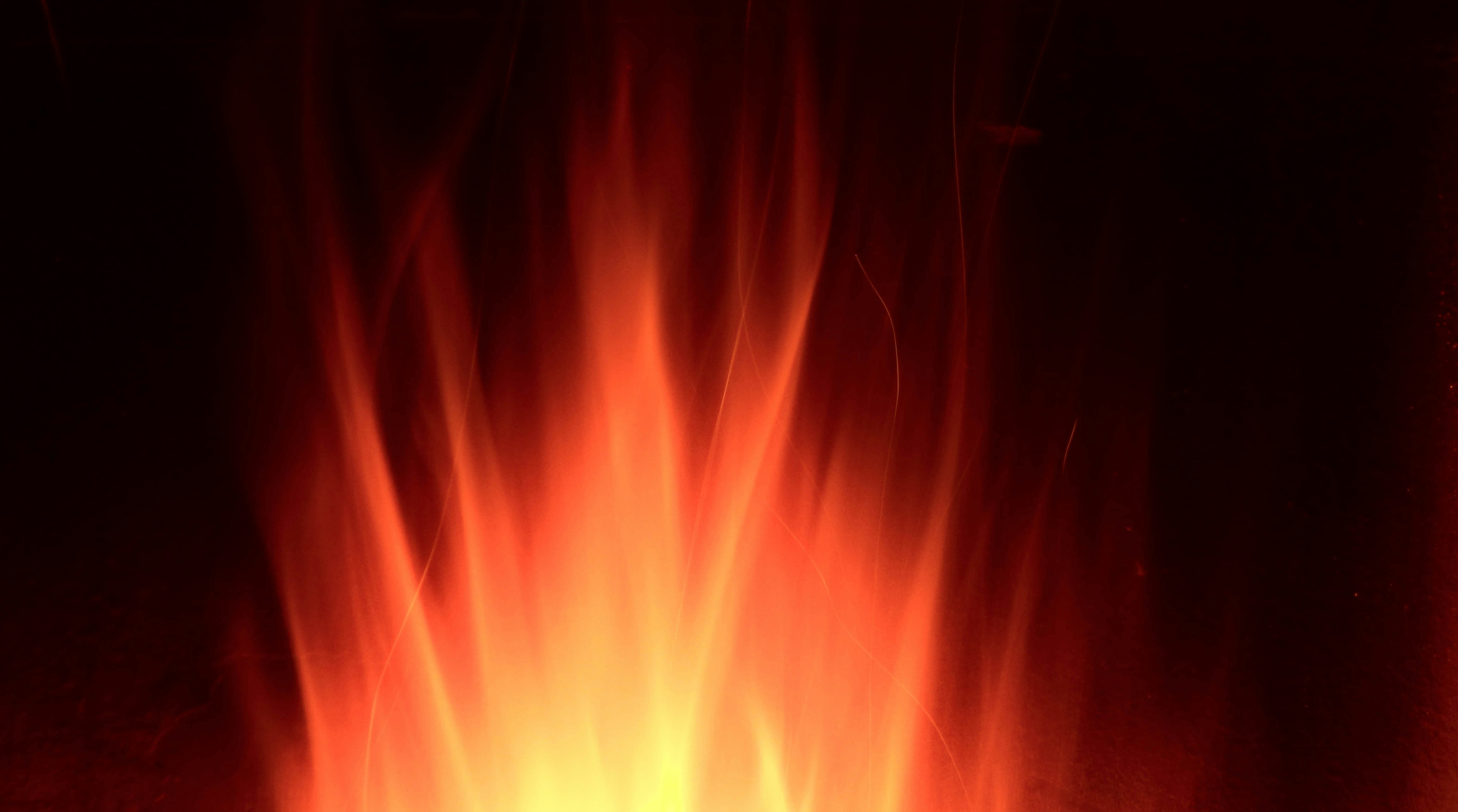 images of people joining hands in flames of fire