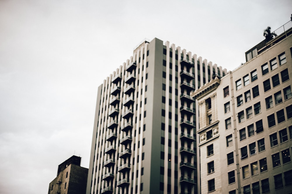 high-rise building under nimbus clouds