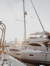 white yacht on dock during daytime