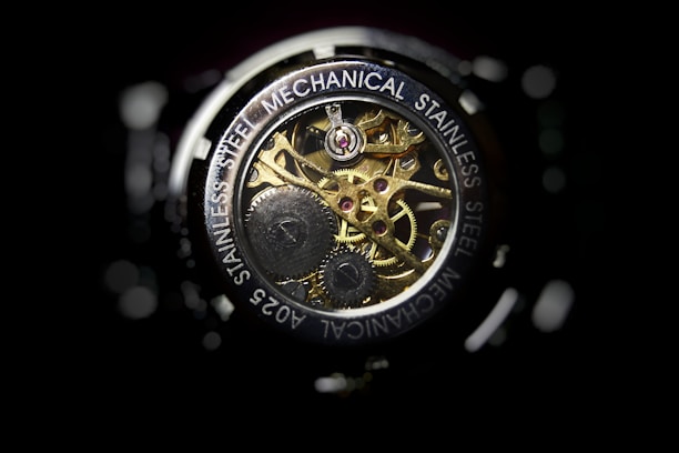 Close-up of a Tissot automatic watch's intricate movement under crystal-clear sapphire glass.