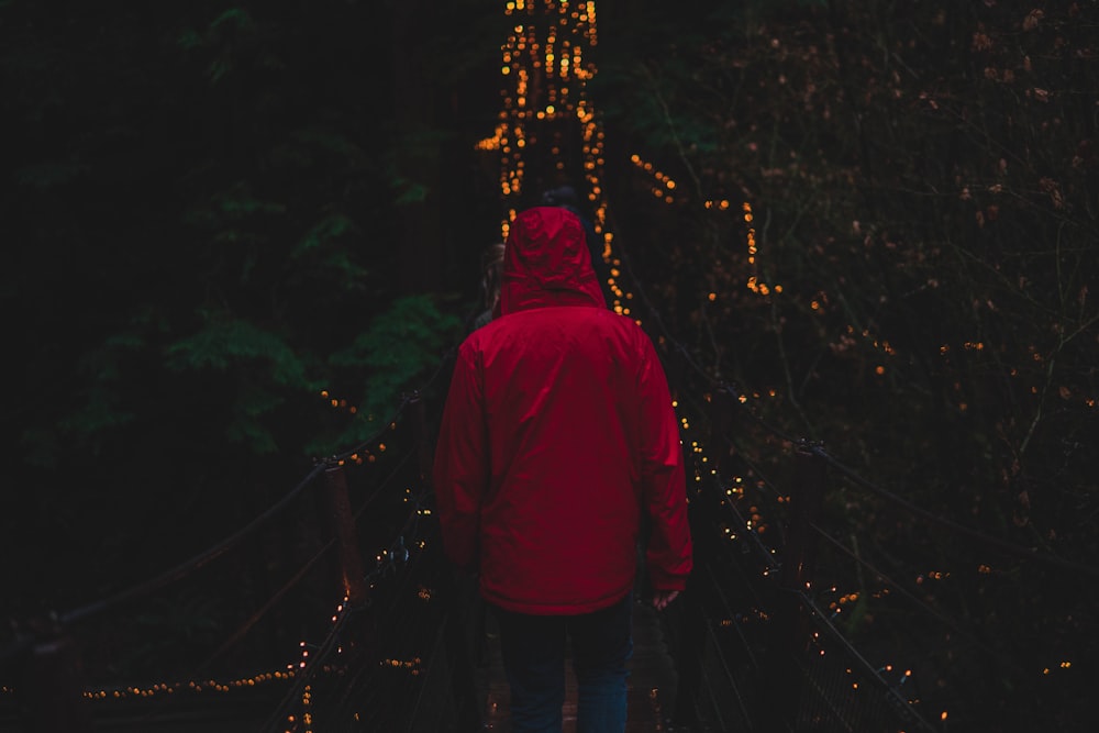 man walking on bridge