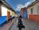 A happy traveler exploring colorful streets in Guatemala.