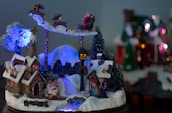 A snowy North Pole village scene at twilight, with cheerful elves working and the radio tower lit up.