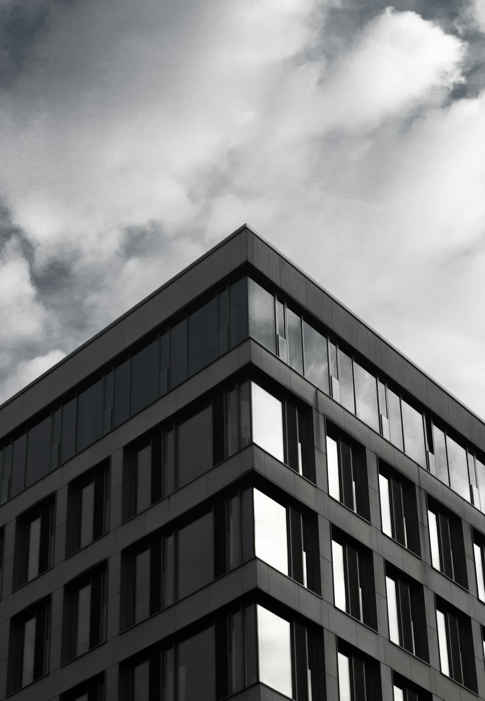 gray building under cloudy sky during daytime