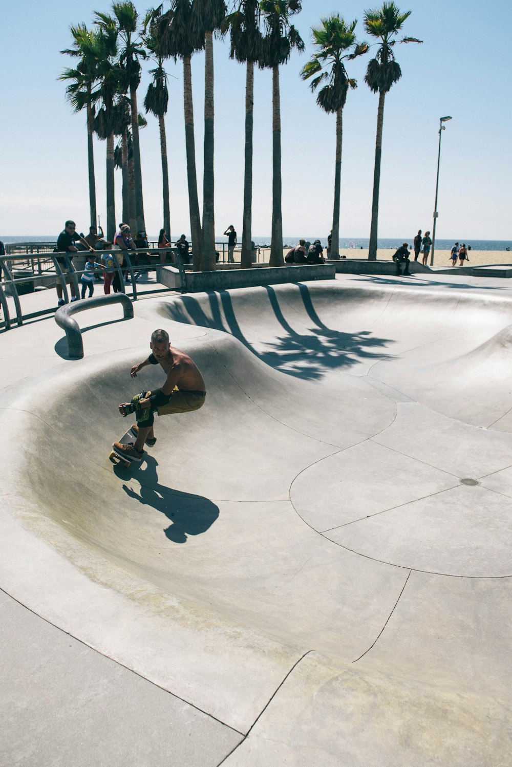 man skateboarding in skateboard track