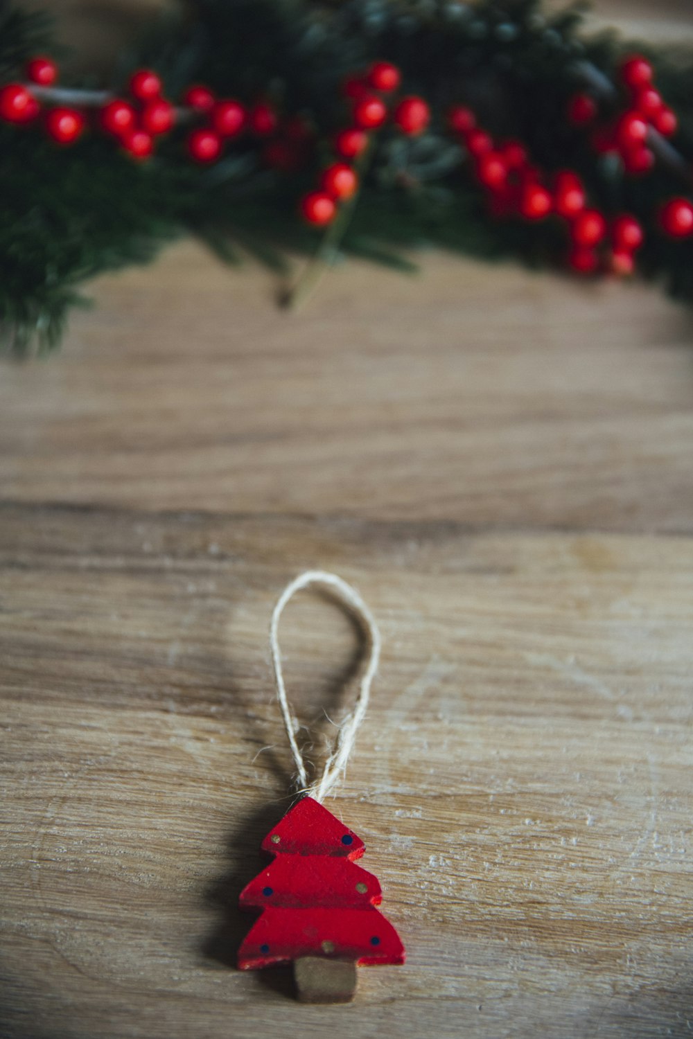 red pine tree hanging decor on brown wood plank