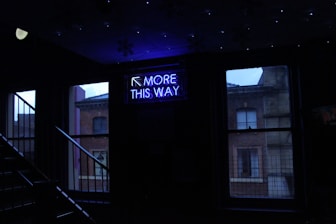 turned on more this way signage