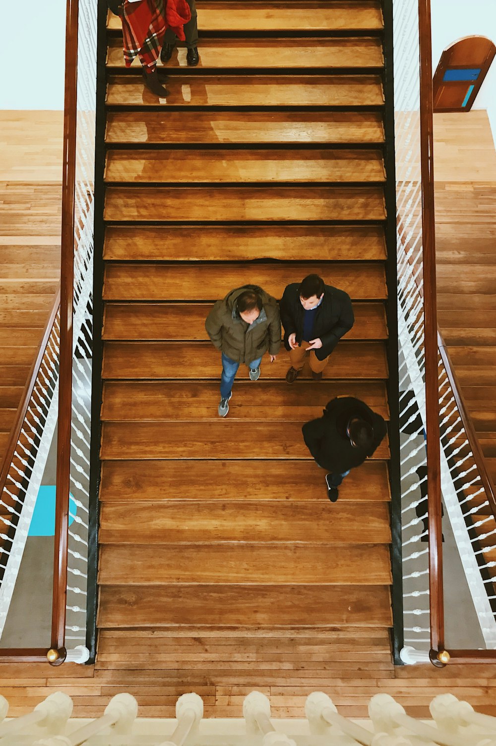 aerial photography of person walking on stair