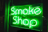 turned on smoke shop NEON signage