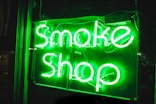 turned on smoke shop NEON signage