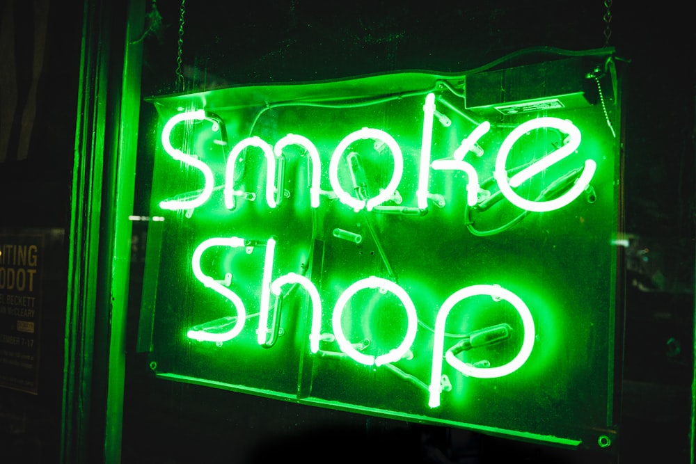 turned on smoke shop NEON signage