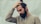 man holding his black hair