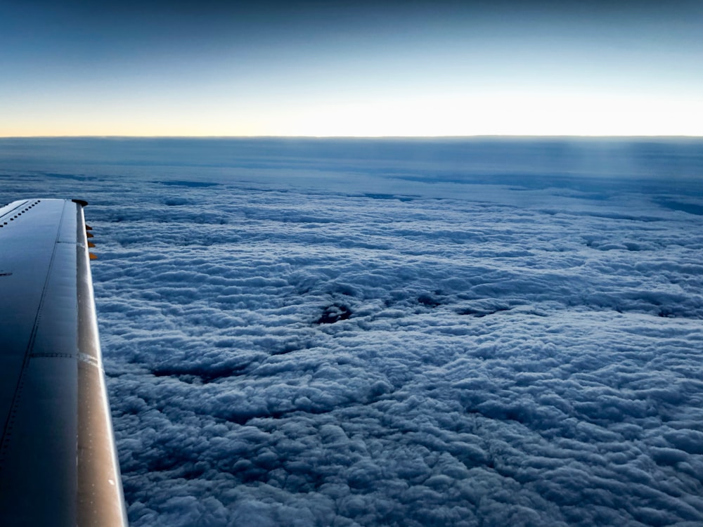 photo of airplane up in the sky