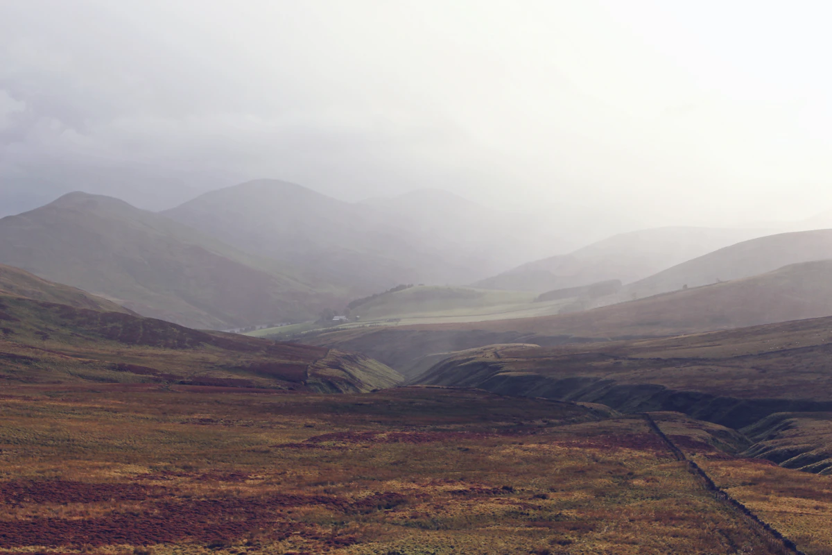 Landscape photography of mountains during foggy weather