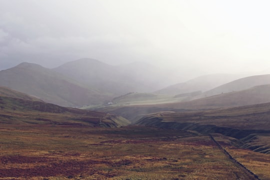 landscape photography of mountains during foggy weather in Pentland Hills United Kingdom
