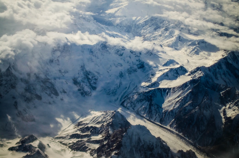 snow covered mountains under sunny sky