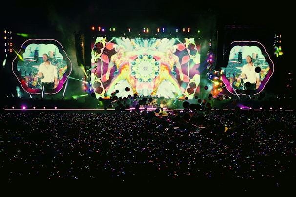 people standing in front of stage partying during nighttime