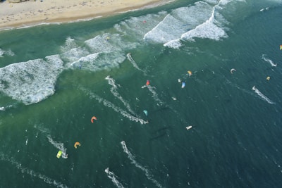 Panoramic view of a popular kitesurfing spot along a lush Brazilian coastline.