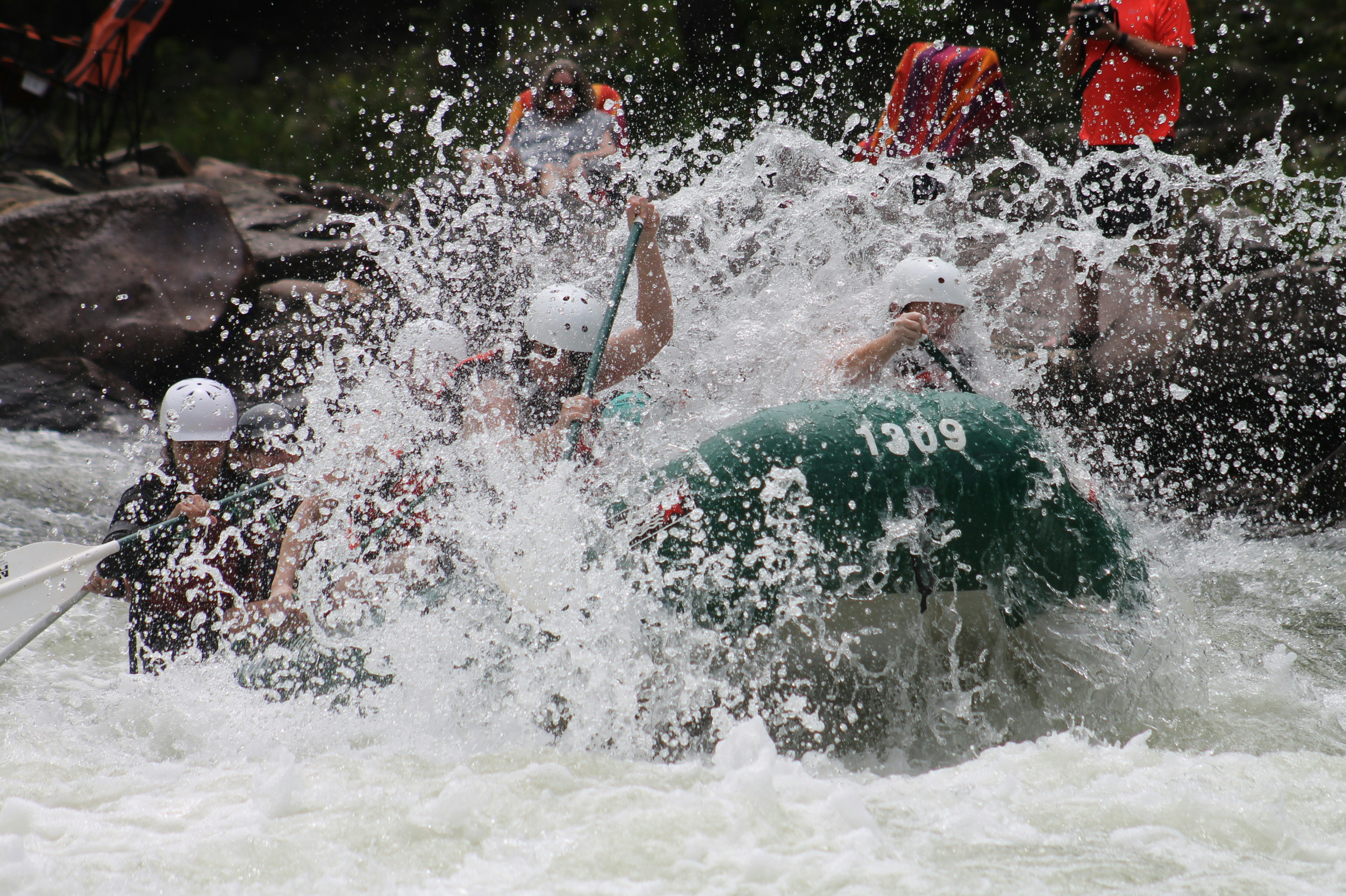 During a hot summer day, if I’m not guiding a raft, I can be found on the banks helping our photo team take photos for our guest to purchase. This particular photo truly captured the splashes and the fun the Ocoee River has to offer!