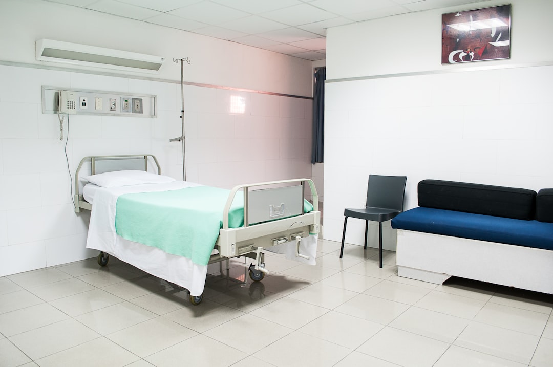 hospital bed near couch,