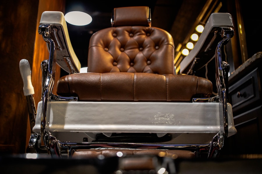 A polished tan leather barber chair under warm light at Blackthorn & Co.