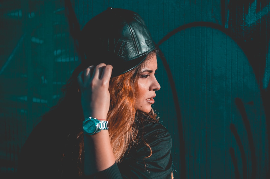 woman wearing black leather fitted cap
