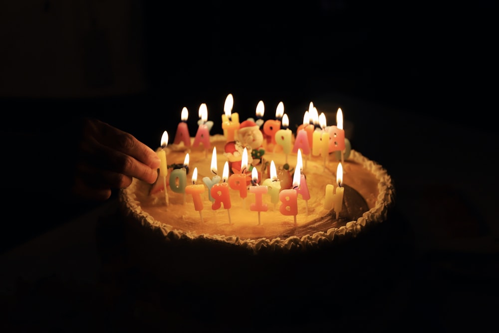 person hand holding candle