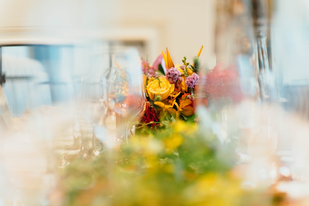 shallow focus photography of assorted-color flowers in vase