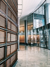 gray tiled floor inside glass walled building with no people