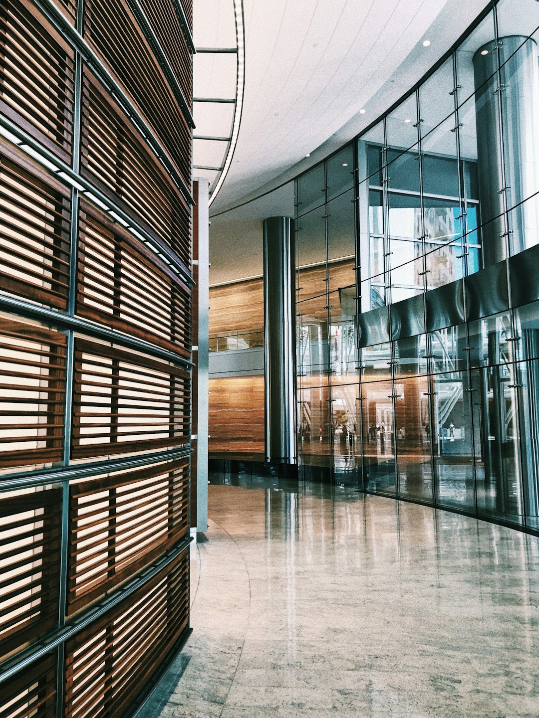 gray tiled floor inside glass walled building with no people